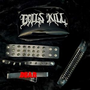 Spiked cuffs, choker, and makeup bag